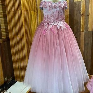 Two couture 12 and 14 kids dresses one is new one worn for just an event